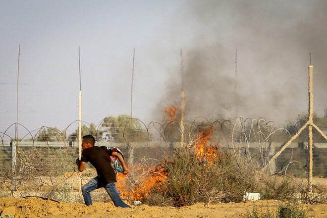 Palestinian rioters clash with Israeli security forces at the Israel-Gaza border, in the eastern part of Rafah, in the southern Gaza Strip on July 5, 2019. Photo by Abed Rahim Khatib/Flash90,