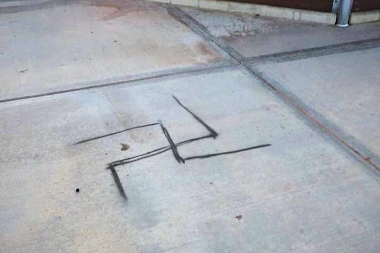A spray-painted swastika was discovered on the concrete next to a baseball field at Dos Vientos Community Park in Conejo Valley, Calif., in 2019. Photo courtesy of the Anti-Defamation League Santa Barbara/Tri-Counties.