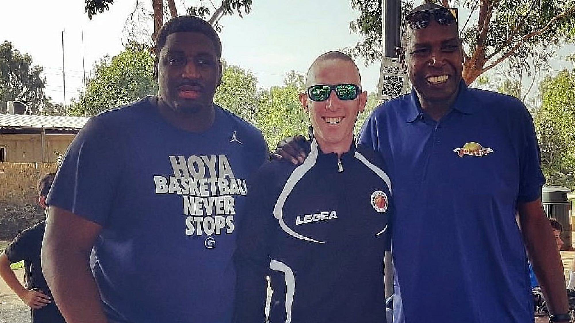 Former pro-basketball players and friends Mike Sweetney (left) and Tamir Goodman (center) at basketball camp in Israel. Credit: Courtesy.