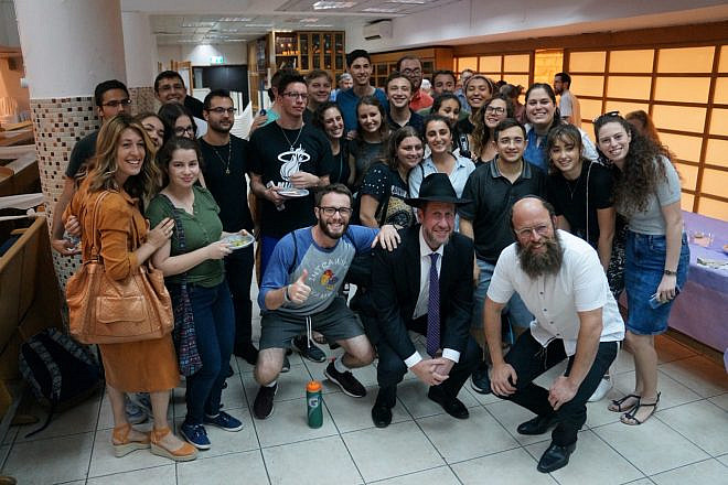 Among the young people who turned out in Jerusalem on July 8, 2019, to celebrate the Lubavitcher Rebbe on his 25th yahrtzeit was London’s Rabbi Yitzchak Schochet (first row, second from right), who came to inspire the crowd. Photo by Shoshana Reiter Halpern.