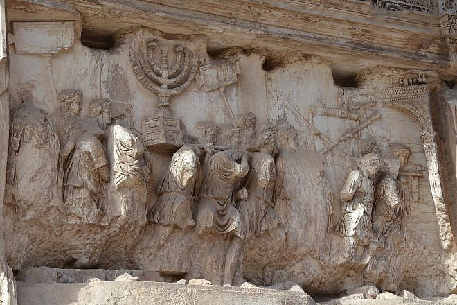 The Arch of Titus in Rome. The arch contains panels depicting the triumphal procession celebrated in 71 C.E. after the Roman victory culminating in the fall of Jerusalem, which is mourned on the Jewish holiday of Tisha B'Av. Credit: Flickr.