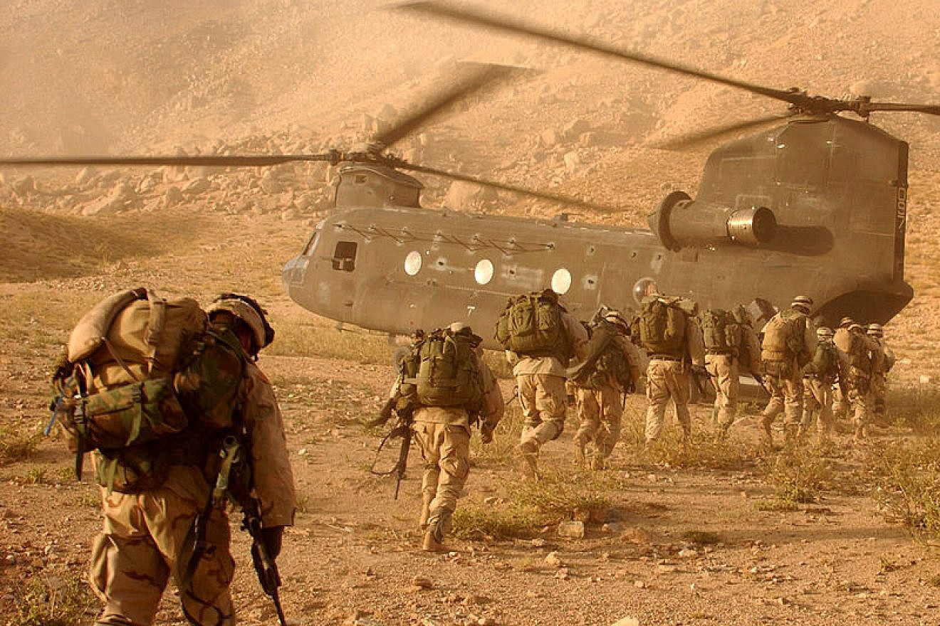U.S. soldiers on the way back to Kandahar Army Air Field on Sept. 4, 2003. The soldiers were searching for Taliban fighters and illegal weapons caches. Photo: Staff Sgt. Kyle Davis/U.S. Army.