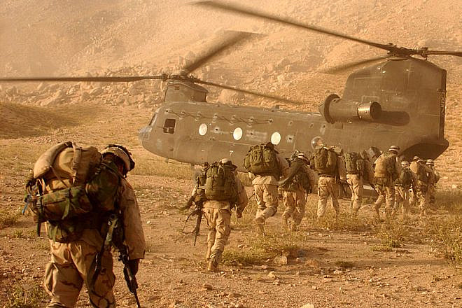 U.S. soldiers on the way back to Kandahar Army Air Field on Sept. 4, 2003. The soldiers were searching for Taliban fighters and illegal weapons caches. Photo: Staff Sgt. Kyle Davis/U.S. Army.