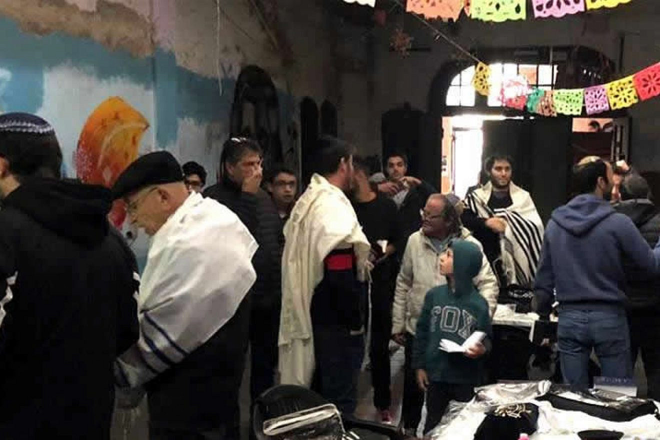 Praying for the first time in decades in one of Argentina's oldest synagogues, August 2019. Credit: Chabad.org/News.