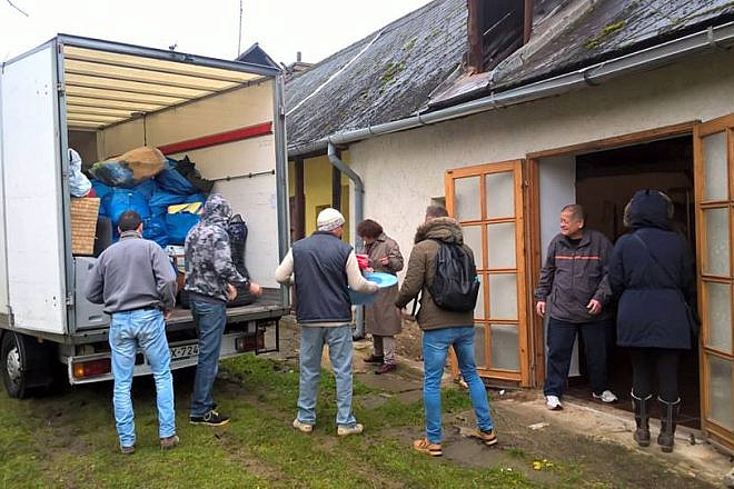 Charity Taxi volunteers delivering donations to the needy of Ozd, Hungary. Credit: Facebook.