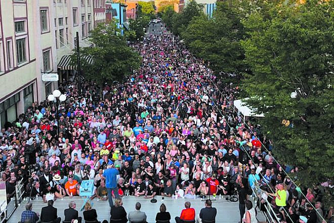 A vigil on East Fifth Street in Dayton’s Oregon District in memory of the nine people gunned down on the street earlier in the day, Aug. 4, 2019. Credit: City of Dayton Public Affairs.