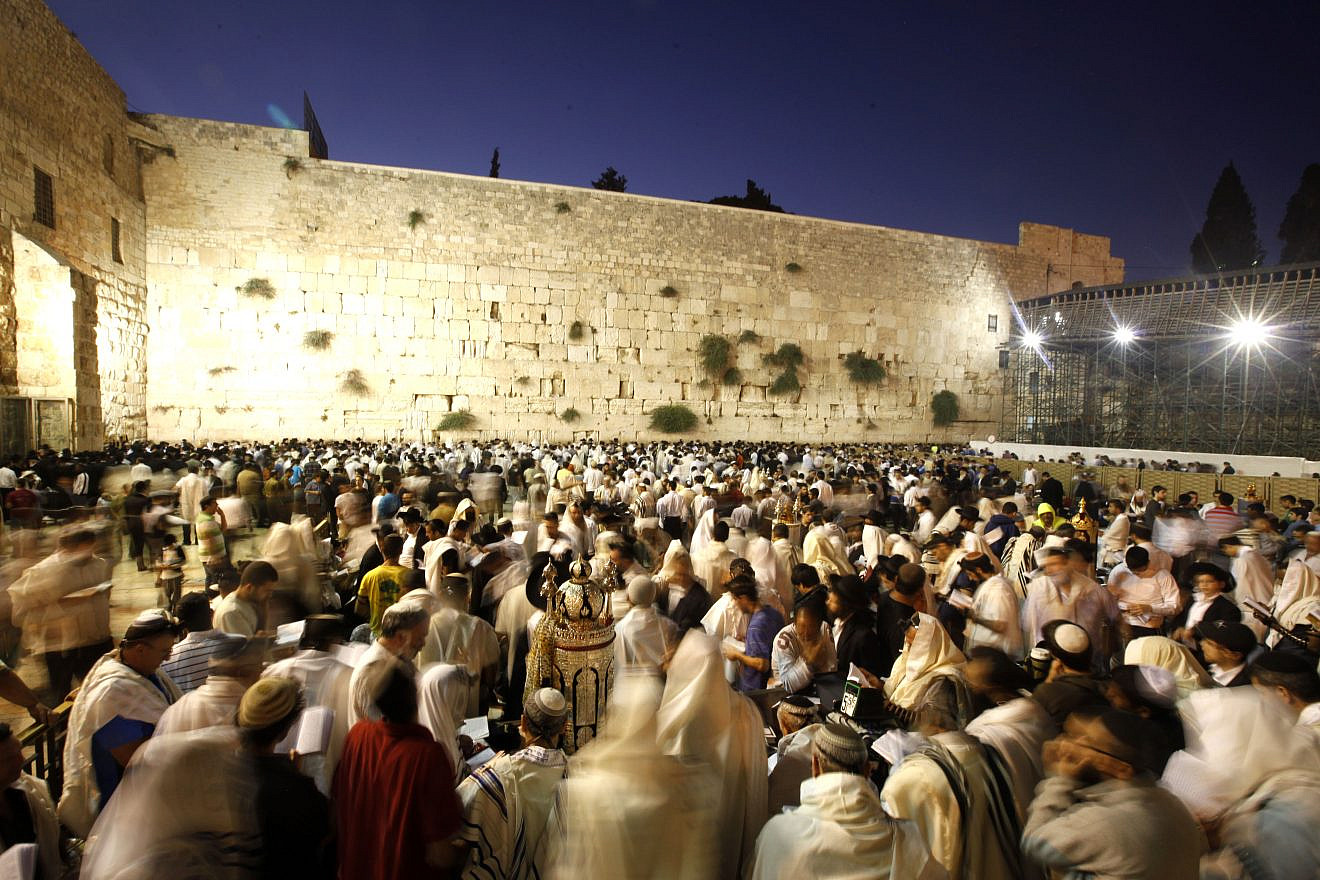 Worshippers gather for the ritual of Tisha B'Av at the Wall Western in the Old City of Jerusalem early morning Aug. 9, 2011. Photo by Miriam Alster/Flash90.