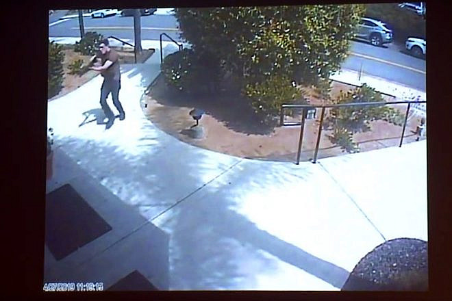 Surveillance footage at the Chabad of Poway, Calif., shown as evidence in the preliminary hearing of John Earnest on Sept. 19, 2019, showing the suspect starting his shooting spree on April 27, 2019. A woman was killed and three others were injured. Credit: Chabad of Poway via San Diego Superior Court.