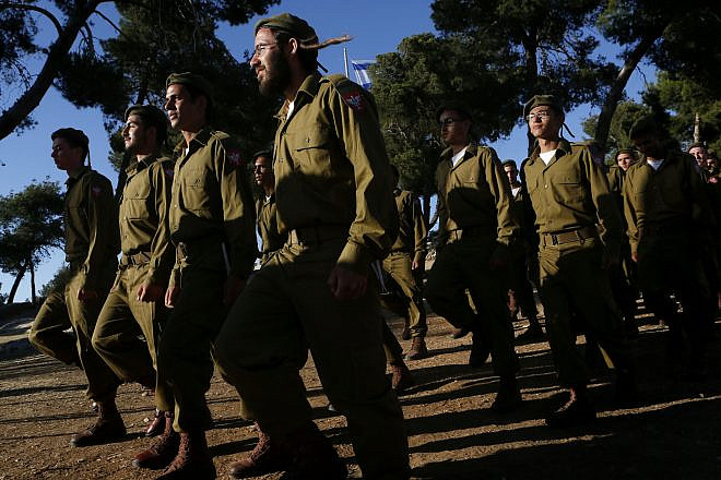 Religious soldiers attend a swearing-in ceremony at Ammunition Hill in Jerusalem upon entering the “Nahal Haredi” unit of the Israel Defense Forces, May 26, 2012. Photo by Miriam Alster/Flash90.