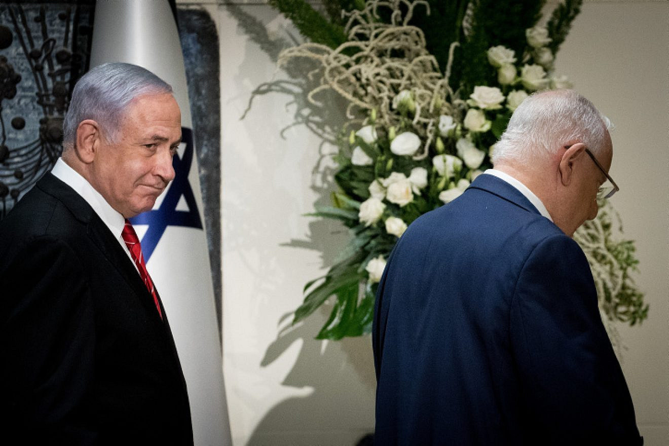 Israeli President Reuven Rivlin presents Prime Minister Benjamin Netanyahu with the mandate to form a new government, at the President's Residence in Jerusalem on Sept. 25, 2019. Photo by Yonatan Sindel/Flash90.