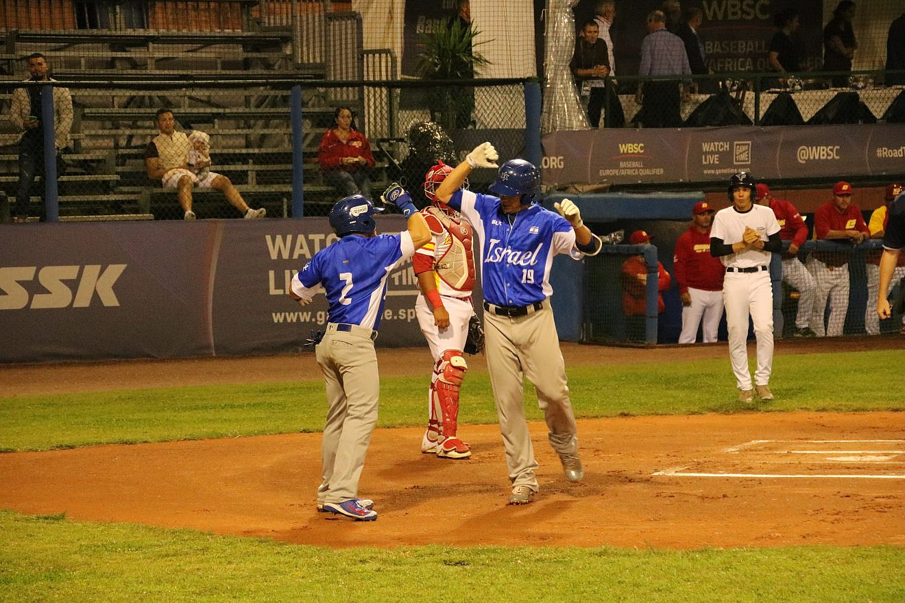 Team Israel celebrates scoring a run during a game against Spain. Photo by Margo Sugarman.
