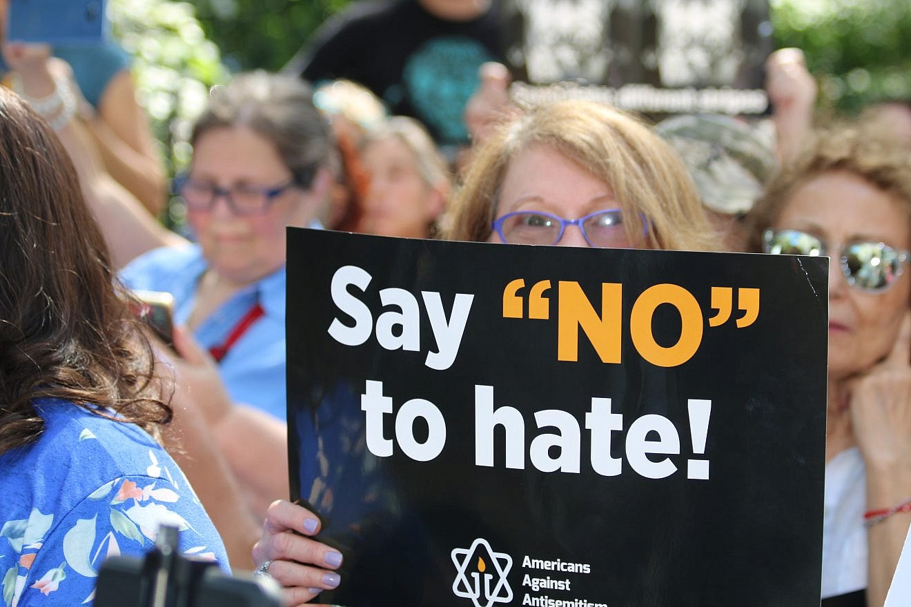 Holding a sign against anti-Semitism at a rally in New York City on Sept. 22, 2019. Photo by Rhonda Hodas Hack.