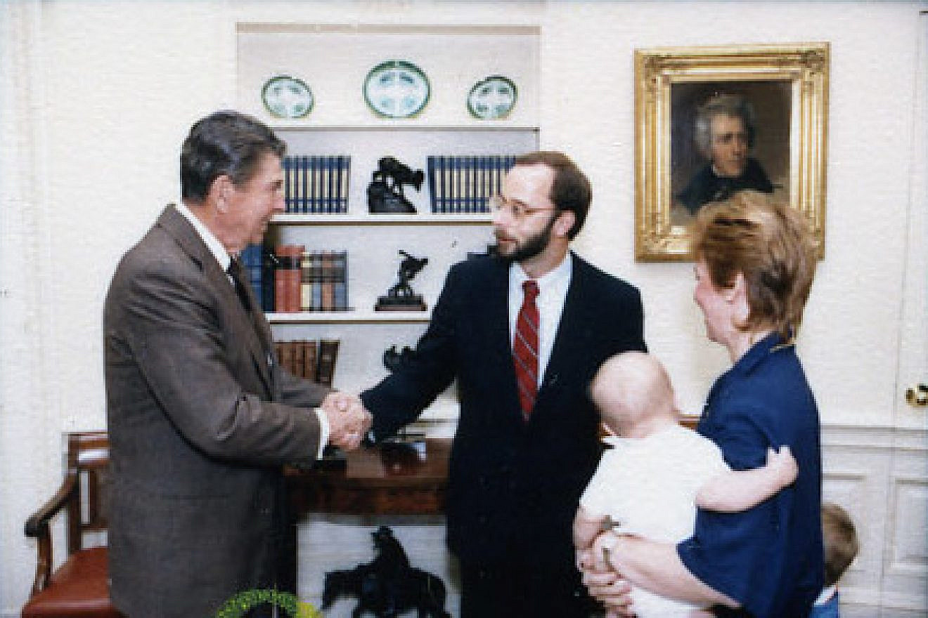 Charles Kupperman greets U.S. President Ronald Reagan in 1987. Credit: Wikipedia.