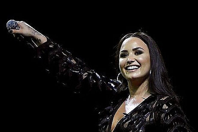 American pop singer Demi Lovato performs in Glasgow, Scotland, during her Tell Me You Love Me world tour, June 13, 2018. Credit: Wikimedia Commons.