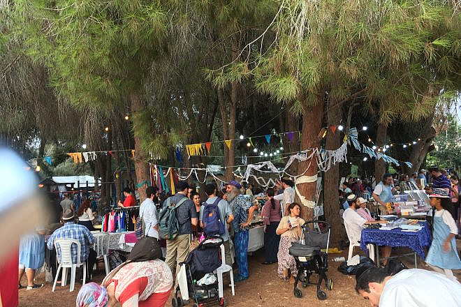 People taking part in the Moshav Fair during Sukkot in Moshav Mevo Modi’im, which was devstated by a wildfire in May 2019. Photo by: Deborah Fineblum.
