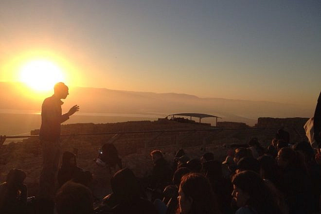 Students at the Alexander Muss High School Program in Israel learn about Jewish history atop Masada. Credit: AMHSI.