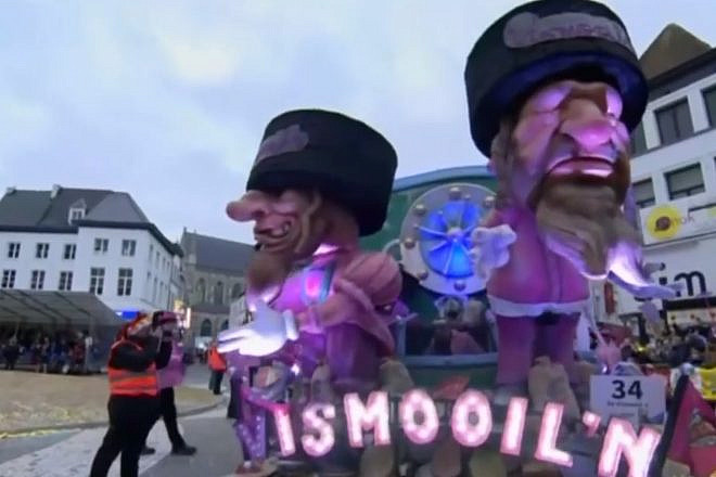 A view of a parade float at the Carnival of Aalst in March 2019, featuring two Orthodox Jewish caricatures that were widely condemned as anti-Semitic. Source: Screenshot.