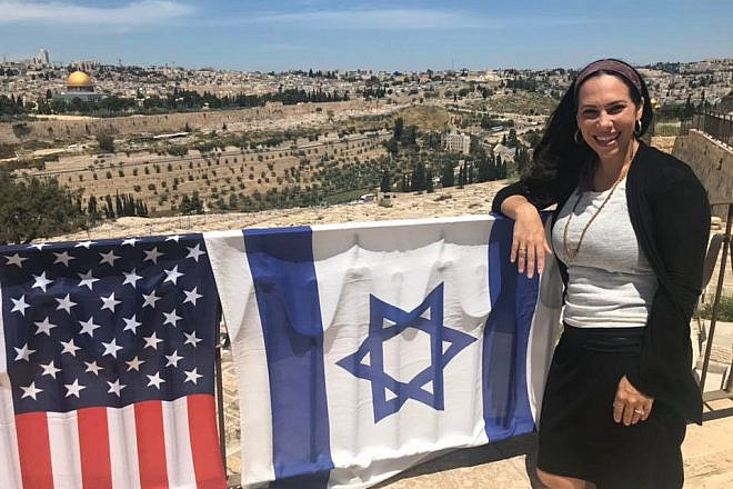 Yael standing on the Mount of Olives overlooking the Old City of Jerusalem. As the new head of the International “Fellowship” that helps 1.5 million people a year, she has taken what her father, Rabbi Yechiel Eckstein, built and is adding her own vision to the 36-year-old organization. Source: Facebook.