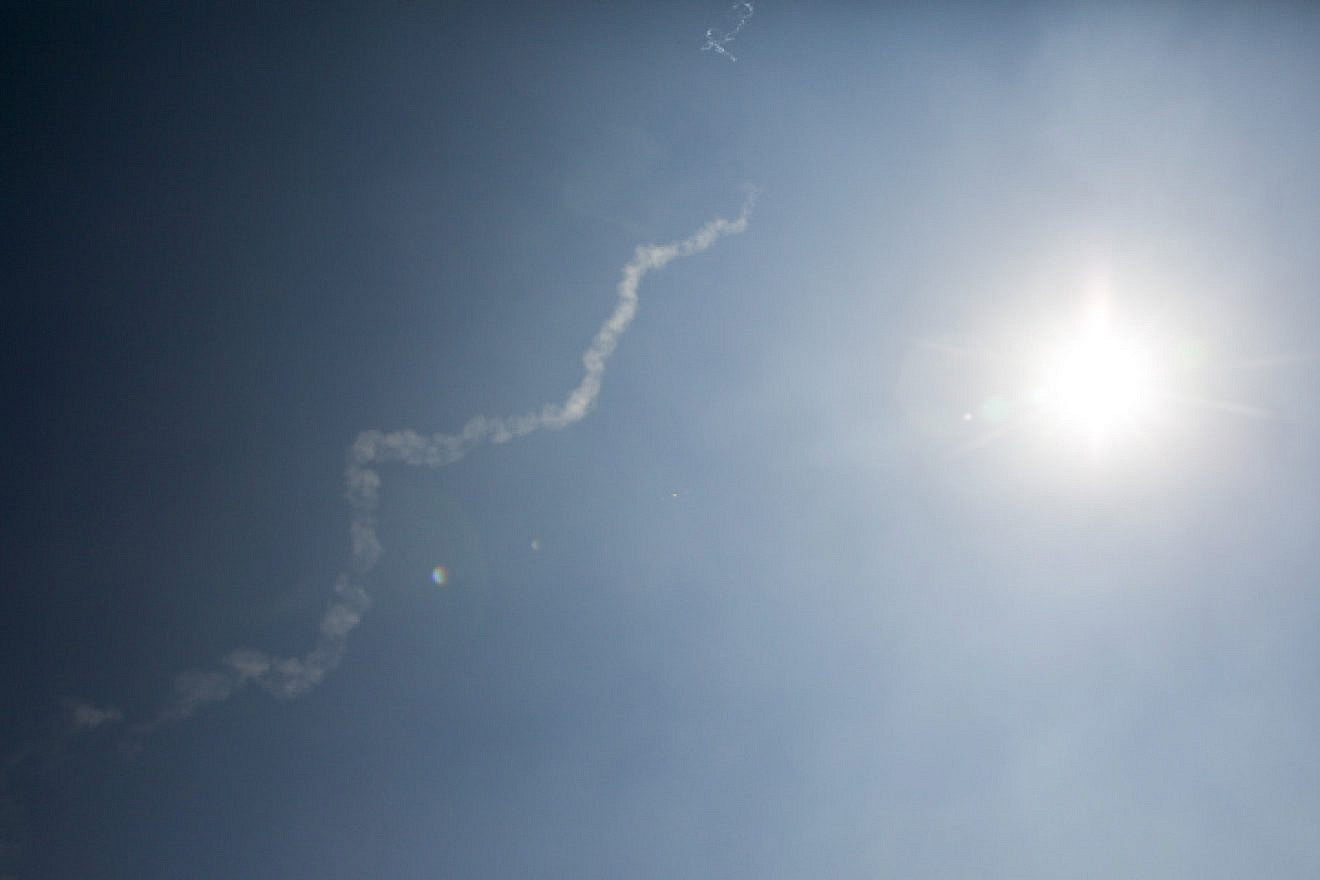The exhaust trail of a David's Sling anti-missile system interceptor is seen following the launch of two OTR-21 "Tochka" tactical ballistic missiles in Syria, on July 23, 2018. Photo by David Cohen/Flash90.