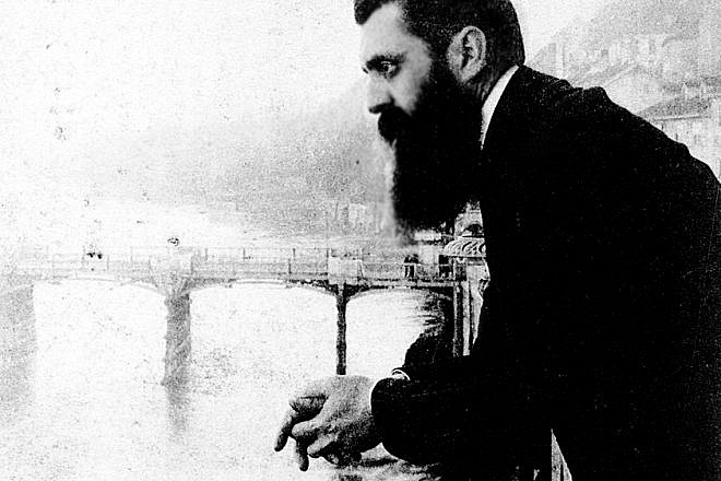 Theodor Herzl leaning over the balcony of the Hotel Les Trois Rois (Three King's Hotel/Hotel drei Könige) in Basel, Switzerland, possibly during the sixth Zionist conference there. Credit: The Bettman Archive.
