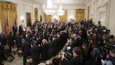 U.S. President Donald Trump listens as Israeli Prime Minister Benjamin Netanyahu addresses his remarks in the East Room of the White House during the unveiling of the Trump administration’s Middle East peace plan, Jan. 28, 2020. Credit: Official White House Photo by Shealah Craighead.