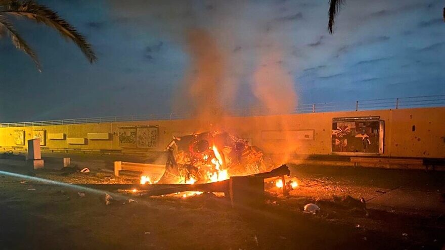 This photo released by the Iraqi Prime Minister's Press Office shows a burning vehicle at the Baghdad International Airport following an airstrike in early on Jan. 3, 2020. The Pentagon announced that the U.S. military killed Maj. Gen. Qassem Soleimani, head of Iran's Quds Force, at the direction of U.S. President Donald Trump. Credit: Iraqi Prime Minister Press Office via AP.