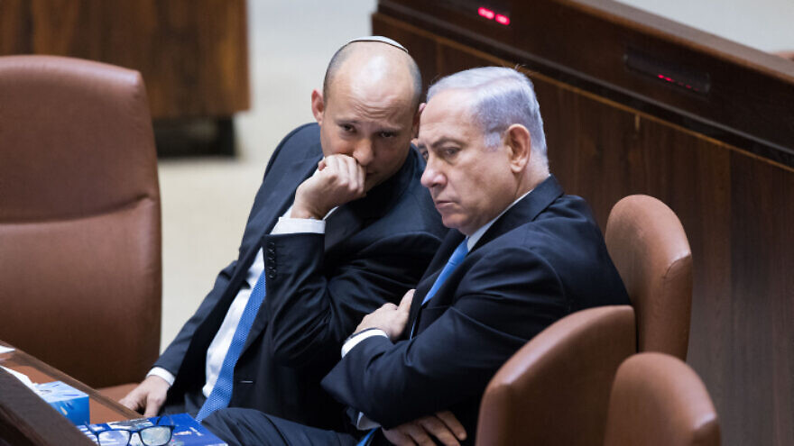 Israeli prime minister Benjamin Netanyahu speaks with Education Minister Naftali Bennett during a plenum session in Knesset in Jerusalem, on Nov. 13, 2017. Photo by Yonatan Sindel/Flash90.