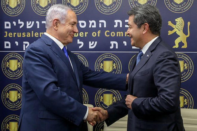 Israeli Prime Minister Benjamin Netanyahu and President of Honduras Juan Orlando Hernández shake hands at the opening of a Honduran Trade Office in Jerusalem, on Sept. 1, 2019. Photo by Marc Israel Sellem/POOL.