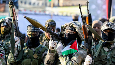 Palestinian terrorists participate in an anti-Israel rally in Khan Yunis in the southern Gaza Strip, on Feb. 17, 2020. Photo by Abed Rahim Khatib/Flash90.