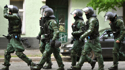 German police on a raid. Credit: Jay P. Lee via Flickr.