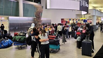 Students from Jewish National Fund-USA’s Alexander Muss High School in Israel program bid emotional farewells to each other after landing back in the United States. Credit: Courtesy JNF-USA.