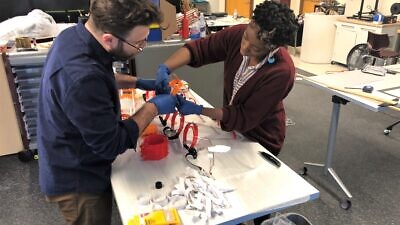 Art teacher Daniel Ostrov and Stephanie Cole work making protective face shields for medical professionals using 3D printers in the school’s Fabrication Laboratory at Kohelet Yeshiva High School in Merion Station, Pa., March 2020, Credit: Courtesy.