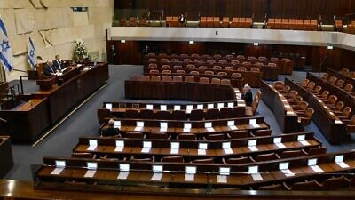 Israeli President Reuven Rivlin addresses a largely empty Knesset for the swearing-in of the 23rd Knesset. Present is Israeli Prime Minister Benjamin Netanyahu, Blue and White leader Benny Gantz, Knesset speaker Yuli Edelstein and Supreme Court president Esther Hayut on March 16, 2020. Photo by Haim Zach/GPO.