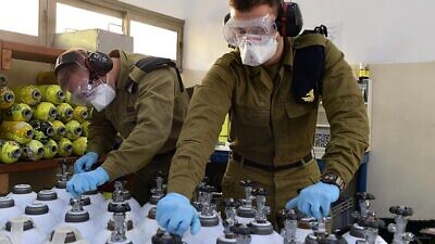 Israel Defense Forces’ soldiers help fill and deliver oxygen tanks as part of the country’s efforts to combat the coronavirus pandemic. Credit: IDF Spokesperson’s Unit.