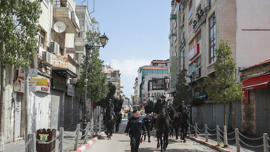 Palestinian Authority security forces patrol the empty streets of Ramallah in the West Bank on March 23, 2020. Photo by Flash90.