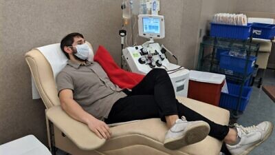 Mendel Mangel, 20, son of Devorah and Rabbi Nochum Mangel of Oakwood, Ohio, donates plasma at the Community Blood Center as part of the Dayton COVID-19 Convalescent Plasma Project,  April 6. 2020.  Credit: Courtesy.