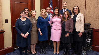 Rep. Carolyn Maloney (D-N.Y.) (left center) next to Rep. Elise Sefanik (R-N.Y.) (right center) along with officials from organizations, including Hadassah and the U.S. Holocaust Memorial Museum, following the passage of the Never Again Holocaust Act by the U.S. House of Representatives. Credit: Phi Nguyen, Official House of Representatives Photographer.
