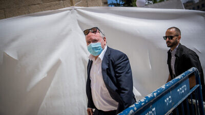 Cyber and National Digital Matters Minister David Amsalem arrives at the District Court in Jerusalem, ahead of the start of Israeli Prime Minister Benjamin Netanyahu's trial on criminal allegations of bribery, fraud and breach of trust. May 24, 2020. Photo by Yonatan Sindel/Flash90.