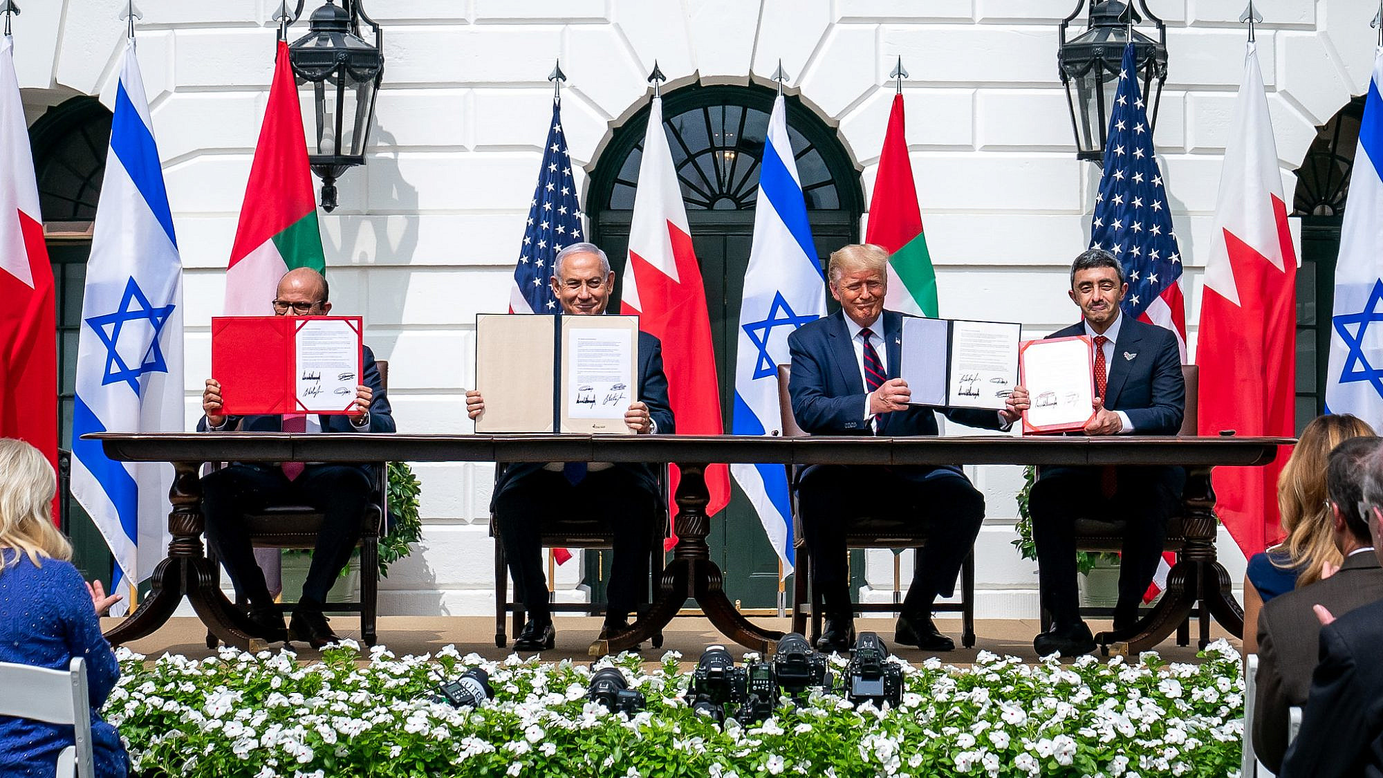 U.S. President Donald Trump, Bahraini Foreign Minister Abdullatif bin Rashid Al-Zayani, Israeli Prime Minister Benjamin Netanyahu and UAE Foreign Minister Abdullah bin Zayed Al Nahyani sign the Abraham Accords on the South Lawn of the White House, Sept. 15, 2020. Credit: White House/Tia Dufour.