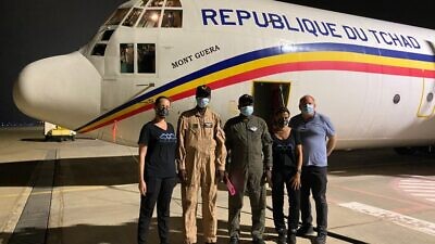 From left: Israeli Flying Aid COO Maya Zuckerman; the pilots of the transport plane sent by Chad; IFA CEO Gal Lusky; and Itai Melchior from the Foreign Trade Administration of the Israeli Ministry of Economy and Industry. Credit: Courtesy/IFA.