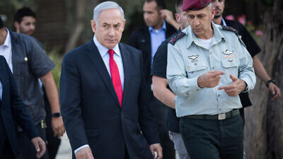 Israeli Prime Minister Benjamin Netanyahu speaks with Israel Defense Forces Chief of Staff Lt. Gen. Aviv Kochavi during an event honoring outstanding IDF reservists at the President's Residence in Jerusalem on July 1, 2019. Photo by Hadas Parush/Flash90.