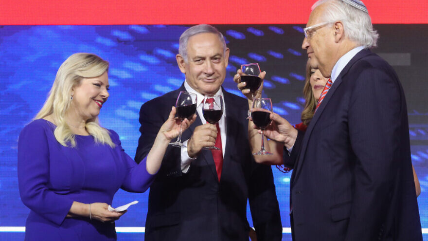 Prime Minister Benjamin Netanyahu, his wife, Sara, and U.S. Ambassador to Israel David Friedman attend an American Independence Day celebration in Jerusalem on July 2, 2019. Photo by Marc Israel Sellem/POOL.