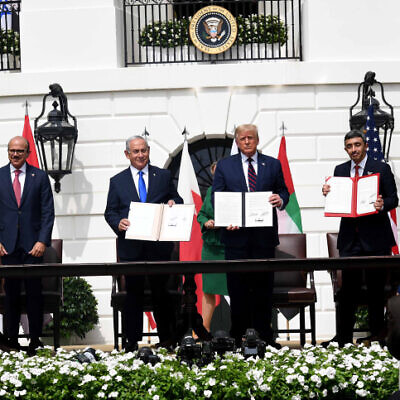 Israeli Prime Minister Benjamin Netanyahu, U.S. President Donald Trump, UAE Foreign Minister Abdullah bin Zayed Al Nahyan and Bahraini Foreign Minister Abdullatif bin Rashid Al Zayani hold up the Abraham Accords, during the signing ceremony at the White House, Sept. 15, 2020. Photo by Avi Ohayon/GPO.