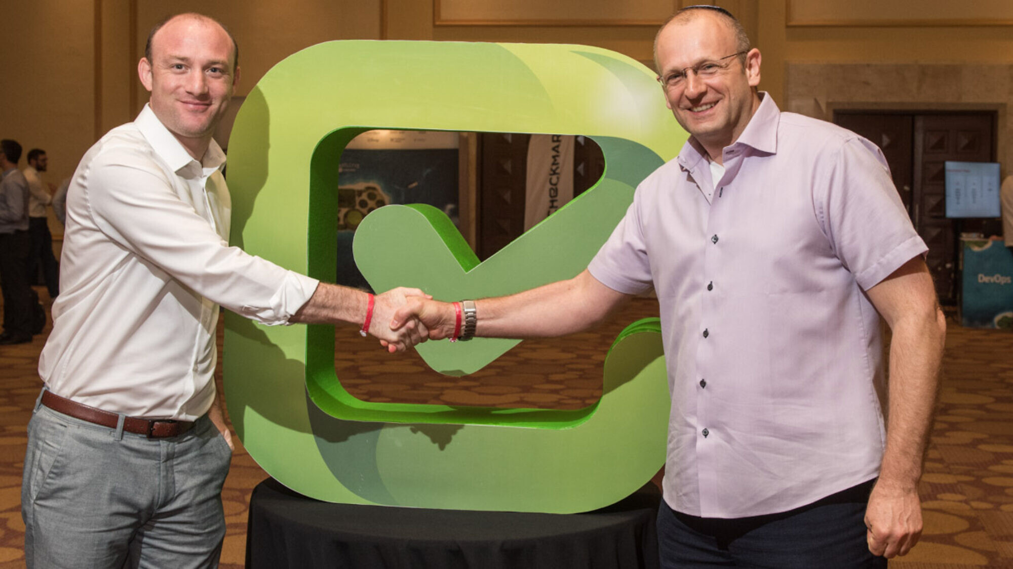 Maty Siman, founder and CTO of Checkmarx shaking hands with CEO Emmanuel Benzaquen. Credit: Courtesy.
