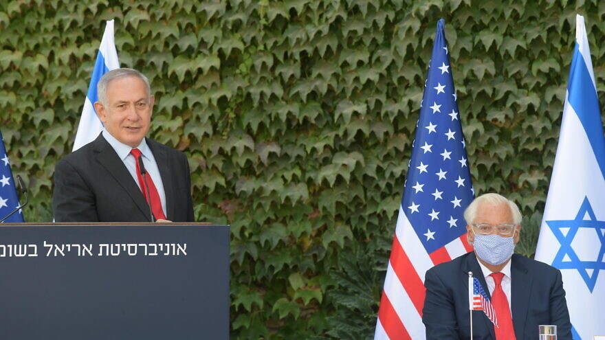Israeli Prime Minister Benjamin Netanyahu delivering remarks at Ariel University, along with U.S. Ambassador to Israel David Friedman. Credit: Amos Ben-Gershom/GPO.