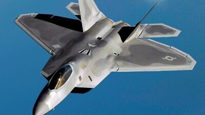 An F-22 Raptor flies over Kadena Air Base, Japan, on a routine training mission in 2009. Photo by Master Sgt. Andy Dunaway via Wikimedia Commons.