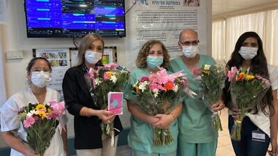 Frontline health-care workers in Israel receive flowers as part of the Shabbat Project 2020. Credit: Courtesy.