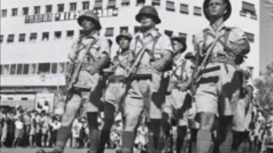 An Irgun parade in 1948. Credit: Wikimedia Commons.