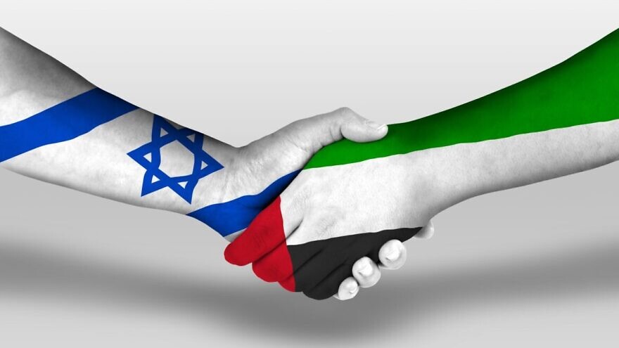 Israel and the UAE "holding hands." Image via Shutterstock.