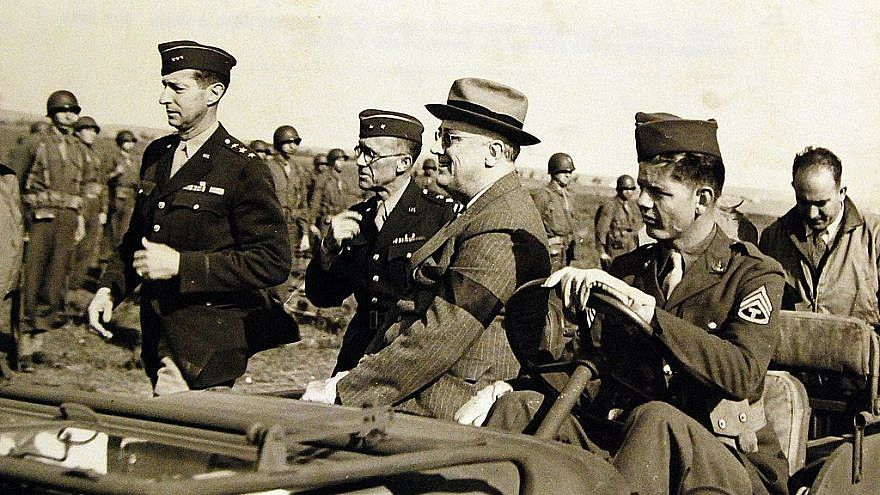 U.S. President Franklin D. Roosevelt reviews his troops in Casablanca from a jeep on Jan. 14, 1943. The tall walking figure at his side is Lt. Gen. Mark W. Clark. Credit: National Museum of the U.S. Navy via Wikimedia Commons.